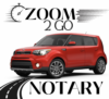 A red car driving down the road with words " zoom 2 go notary ".