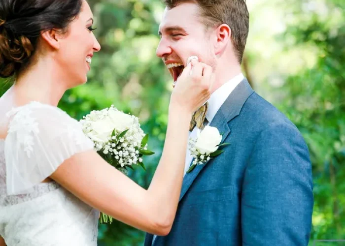 rs=w_600,h_600,cg_true A bride and groom smiling at each other.